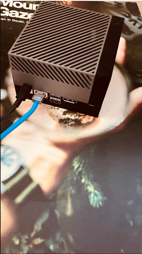 An NVIDIA Jetson edge AI box sitting on a magazine cover